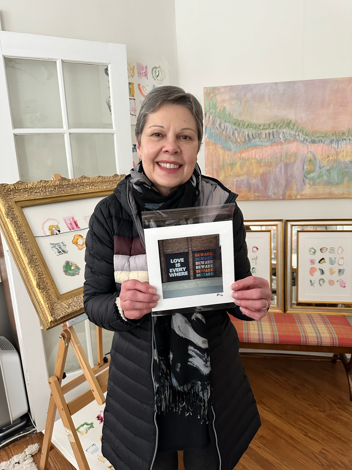 Collector holding her new framed Eric Petersen photograph